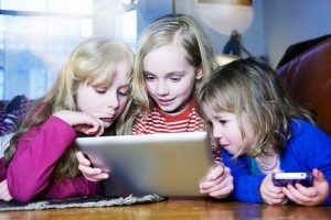 Three-young-girls-playing-with-digital-tablet