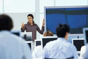 businesswoman training business executives at a seminar