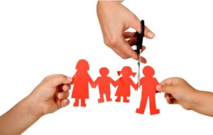 Divorce effect on kids concept with hands cutting paper people family - isolated; Shutterstock ID 58110952